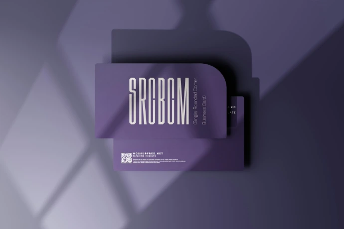 a book with a shadow on a purple background